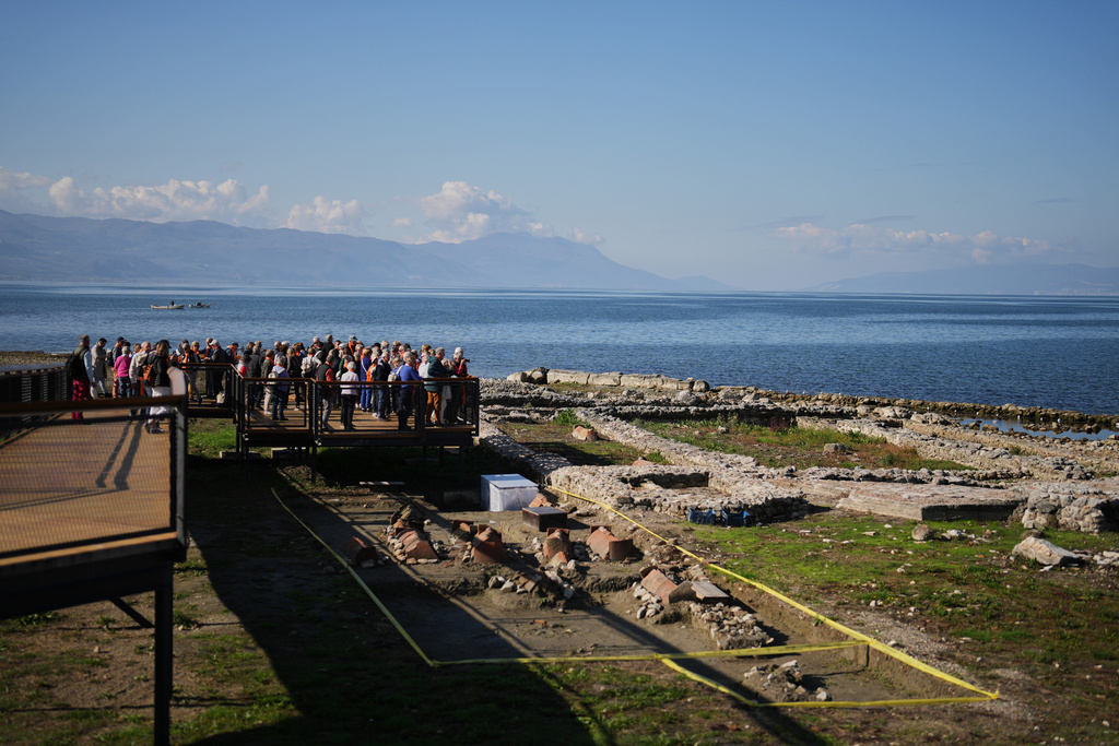 French pilgrims look at archaeological excavations of the ancient Byzantine-era Christian Saint Neophytos Basilica, in Iznik, also known by its ancient name Nicaea, northwestern Turkey, Thursday, Nov. 13, 2025, ahead of the visit of Pope Leo XIV to mark the 1,700th anniversary of the First Council of Nicaea. (AP Photo/Francisco Seco)