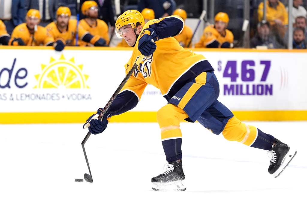 Nashville Predators defenseman Justin Barron (20) breaks his stick as he shoots the puck during the second period of an NHL hockey game against the Philadelphia Flyers, Thursday, Nov. 6, 2025, in Nashville, Tenn. (AP Photo/George Walker IV)