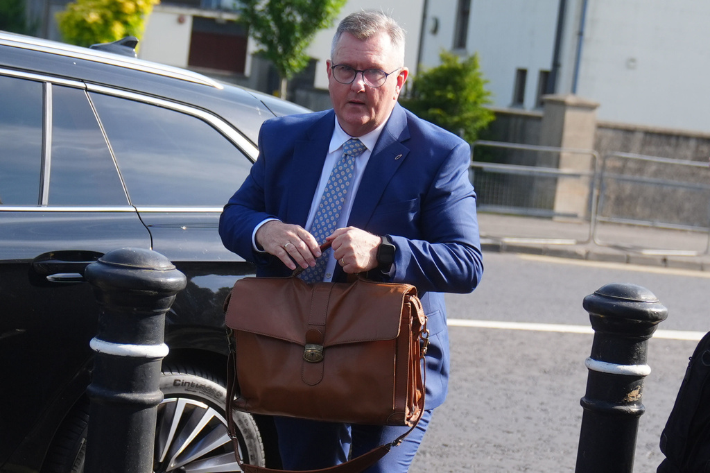Jeffrey Donaldson arrives at Newry Crown Court, England, where he and his wife Eleanor Donaldson are accused of historical sexual offences, on Wednesday May 27, 2026. (Brian Lawless/PA via AP)