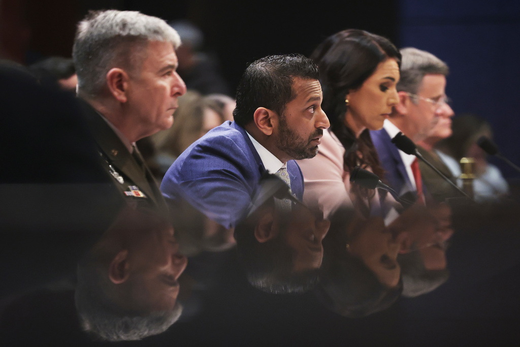From left, Acting Commander of the U.S. Cyber Command William Hartman, FBI Director Kash Patel, Director of National Intelligence Tulsi Gabbard and CIA Director John Ratcliffe, listen during a House Permanent Select Committee on Intelligence hearing to examine worldwide threats, Thursday, March 19, 2026, on Capitol Hill in Washington. (AP Photo/Tom Brenner)