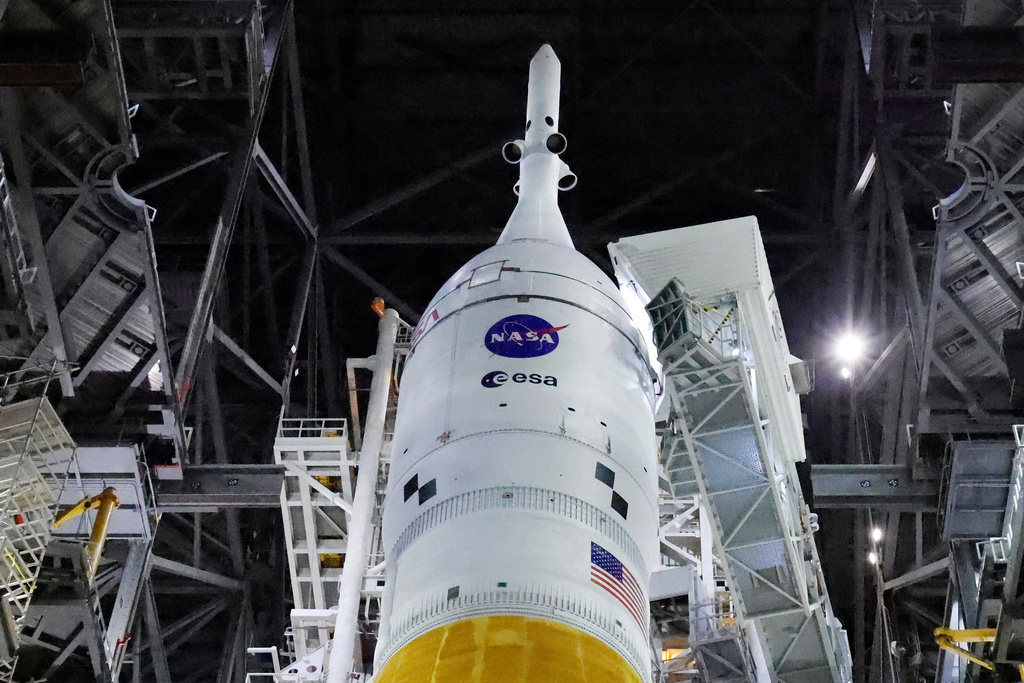 The Orion spacecraft sits on top of the NASA Artemis II rocket in the Vehicle Assembly Building before rollout to pad 39B at the Kennedy Space Center in Cape Canaveral, Fla., Thursday, March 19, 2026. (AP Photo/Terry Renna)