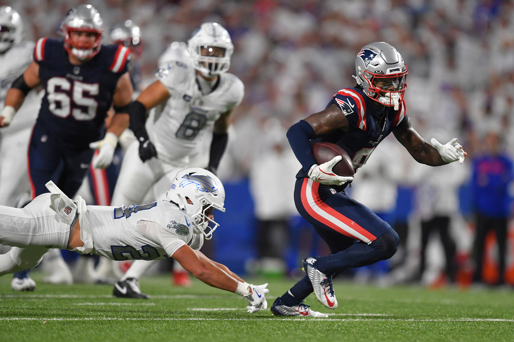New England Patriots wide receiver Stefon Diggs, right, runs past Buffalo Bills safety Cole Bishop (24) during the second half of an NFL football game, Sunday, Sept. 5, 2025, in Orchard Park, N.Y. (AP Photo/Adrian Kraus)