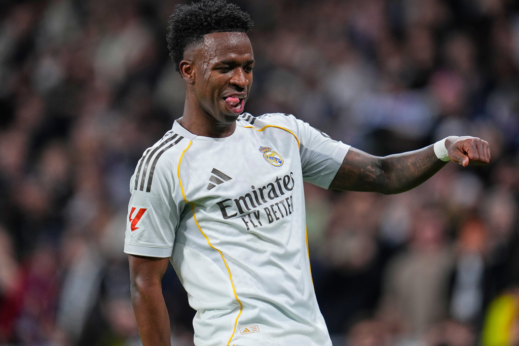 Real Madrid's Vinicius Junior celebrates scoring his side's 2nd goal from the penalty spot during the Spanish La Liga soccer match between Real Madrid and Real Sociedad in Madrid, Spain, Saturday, Feb. 14, 2026. (AP Photo/Manu Fernandez)