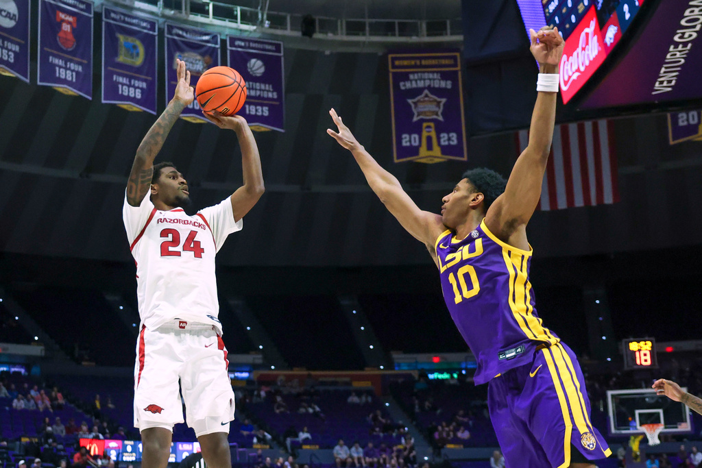 Arkansas forward Billy Richmond III (24) shoots a jumper over LSU forward Marquel Sutton (10) during the first half of an NCAA college basketball game in Baton Rouge, La., Tuesday, Feb. 10, 2026. (AP Photo/Peter Forest)