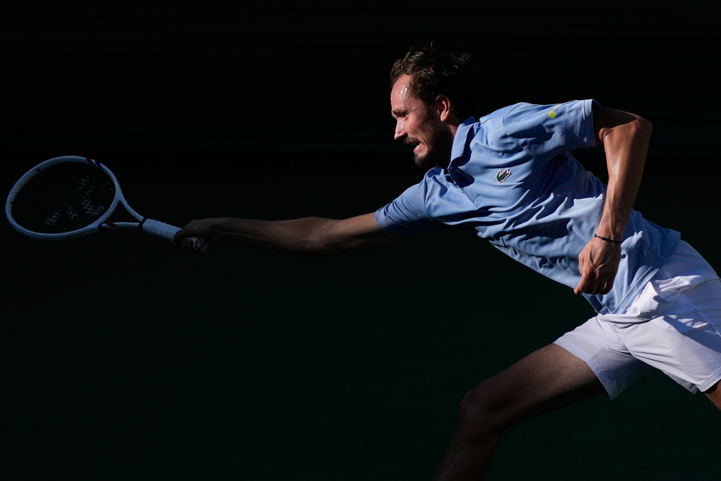 Daniil Medvedev, of Russia, tries to return a shot against Carlos Alcaraz, of Spain, during a semifinal match at the BNP Paribas Open tennis tournament, Saturday, March 14, 2026, in Indian Wells, Calif. (AP Photo/Mark J. Terrill)