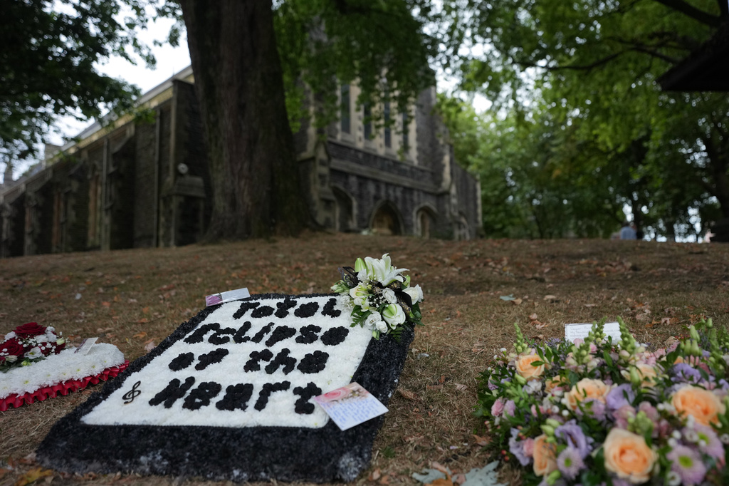 Flowers are decorated outside St. Mary's Church in Swansea, Wales, Monday, Aug. 17, 2026 for the funeral of Bonnie Tyler after The Total Eclipse Of The Heart musician, whose real name was Gaynor Hopkins, died in hospital in Portugal on July 8 at the age of 75. (AP Photo/Alastair Grant)