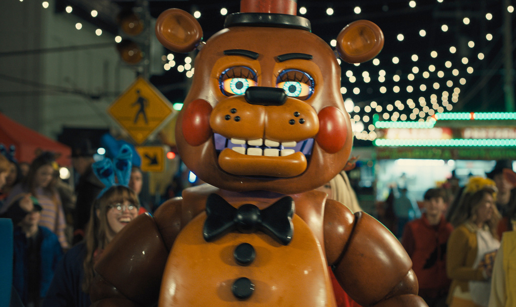 This image released by Universal Pictures shows Toy Freddy, voiced by Kellen Goff, in a scene from "Five Nights at Freddy's 2." (Ryan Green/Universal Pictures via AP)