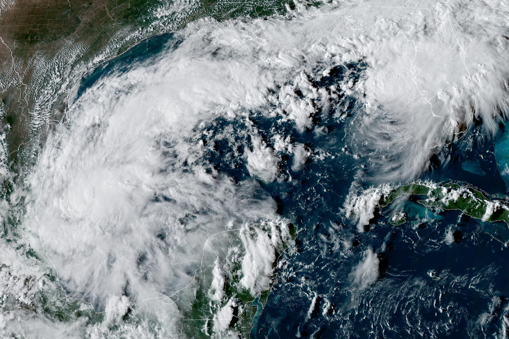 This satellite image from the National Oceanic and Atmospheric Administration shows Tropical Depression Nine forming over the Gulf of Mexico on Tuesday, Oct. 6, 2026. (NOAA via AP)