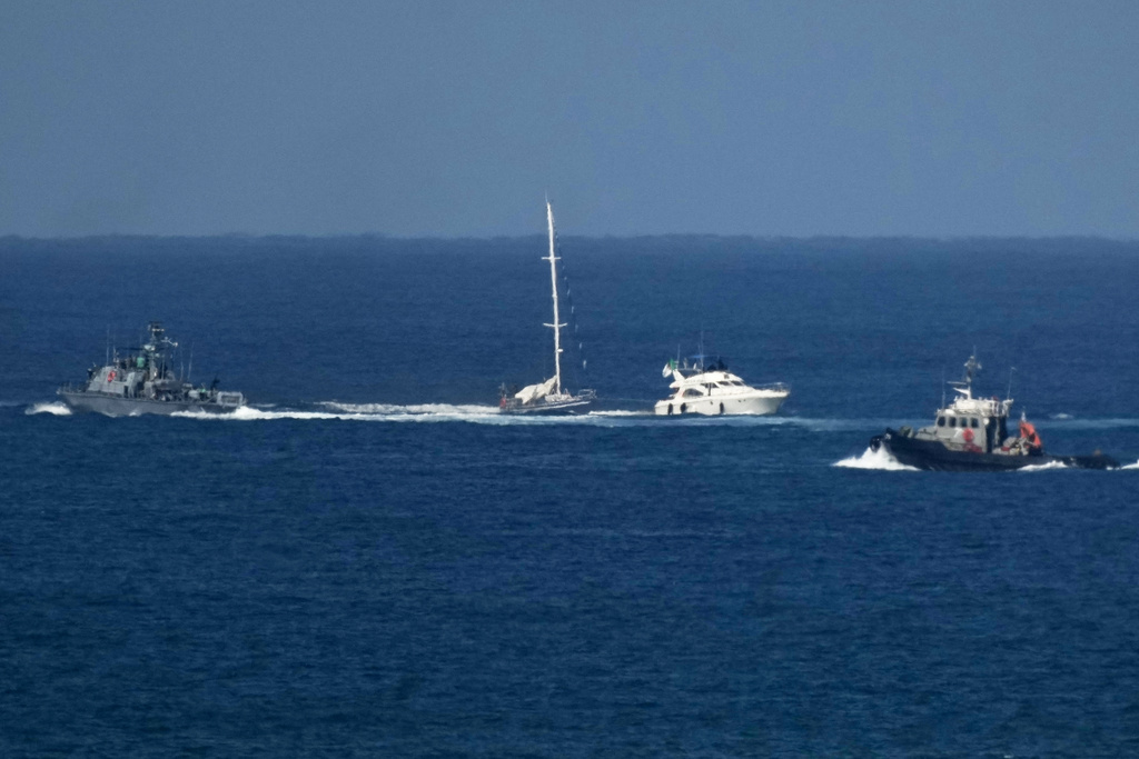 An Israeli Navy vessel sails next to two smaler boats in the Mediterranean sea close to the port of Ashdod, Israel, Thursday, Oct. 2, 2025. (AP Photo/Leo Correa)