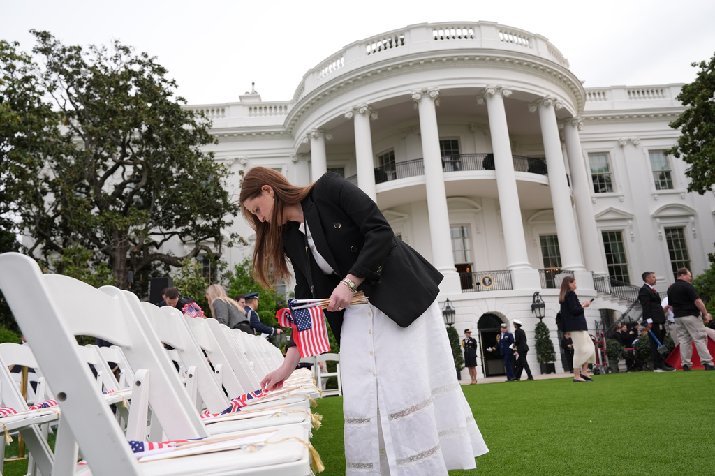 Staff members prepare the South Lawn before President Donald Trump and first lady Melania Trump welcome Britain's King Charles III and Queen Camilla during a State Visit arrival ceremony at White House, Tuesday, April 28, 2026, in Washington. (AP Photo/Jacquelyn Martin)