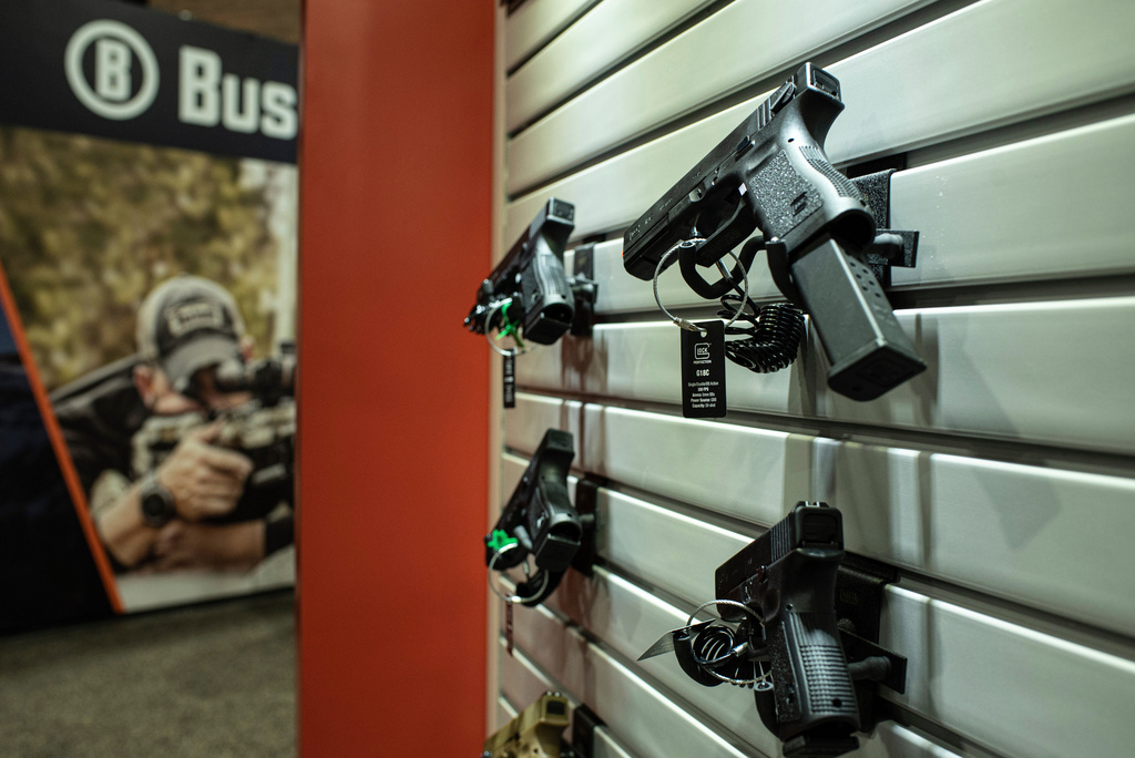 FILE - This photo taken Wednesday, Jan. 22 2020, shows firearms on display at SHOT Show, the annual trade show sponsored by the National Shooting Sports Foundation, in Las Vegas. (AP Photo/Lisa Marie Pane, file)