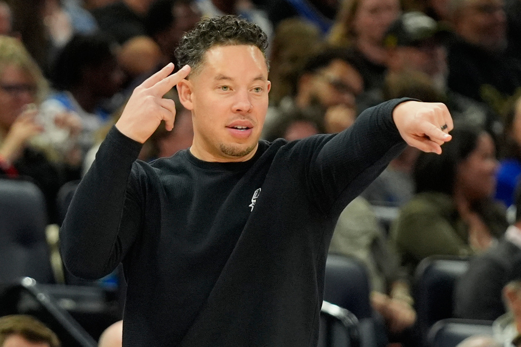 San Antonio Spurs head coach Mitch Johnson directs players during the first half of an NBA basketball game against the Orlando Magic, Wednesday, Dec. 3, 2025, in Orlando, Fla. (AP Photo/John Raoux)