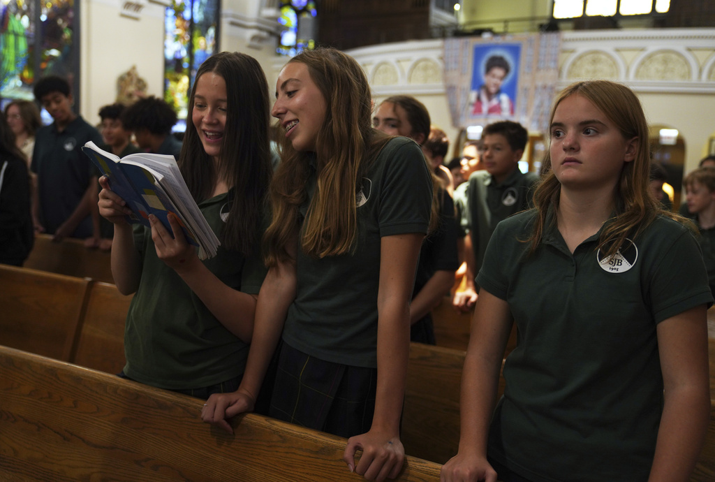 St. John Berchmans' school students attend a Mass at Blessed Carlo Acutis Parish on Wednesday, Sept. 3, 2025, in Chicago. (AP Photo/Jessie Wardarski)