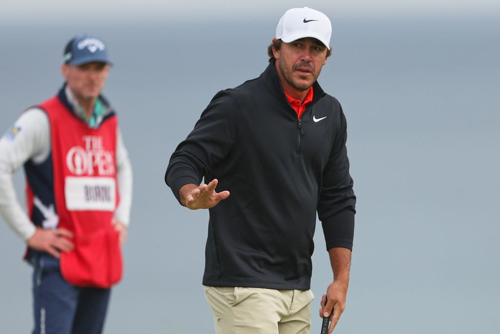 FILE - Brooks Koepka, of the United States, acknowledges the crowd on the 5th green during the first round of the British Open golf championship at the Royal Portrush Golf Club in Northern Ireland, July 17, 2025. (AP Photo/Peter Morrison, File)