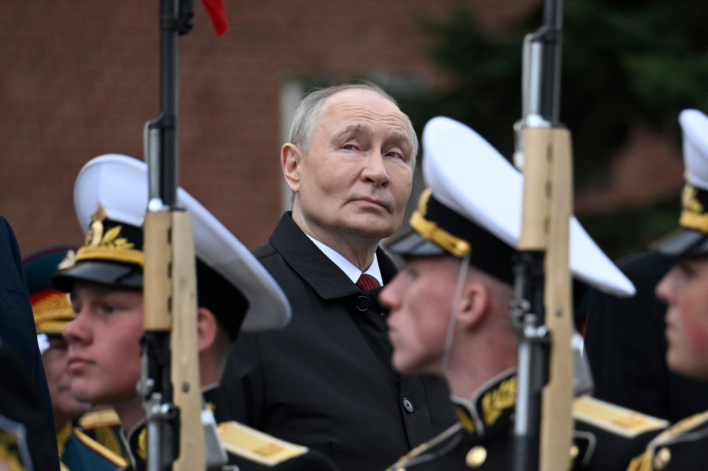 Russian President Vladimir Putin, centre foreground, attends a ceremony to lay flowers at the Tomb of the Unknown Soldier by the Kremlin wall inMoscow, Saturday, May 9, 2026, during celebrations of the 81st anniversary of the Soviet Union's victory over Nazi Germany during the World War II. (Alexander Nemenov/Pool Photo via AP)