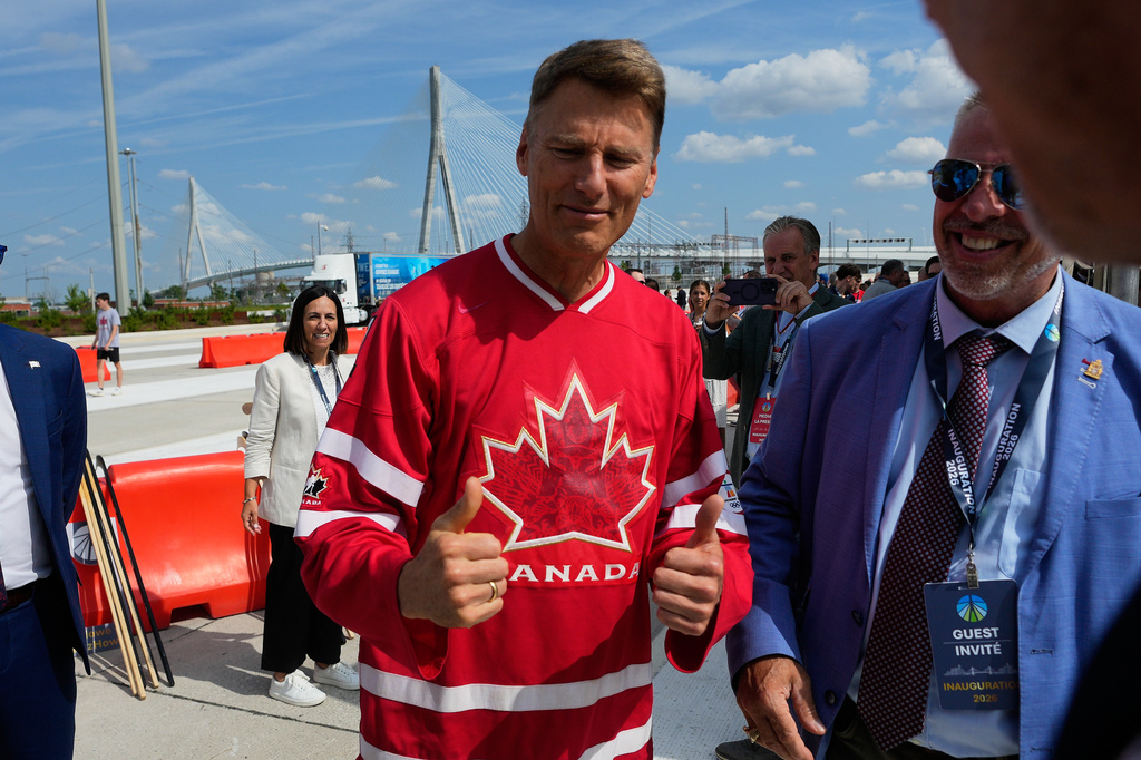 Gregor Robertson, Canadian Minister of Housing and Infrastructure gives thumbs up during a Canadian celebration for the Gordie Howe International bridge connecting Detroit and Windsor, Ontario Friday, July 24, 2026, in Windsor. (AP Photo/Paul Sancya)