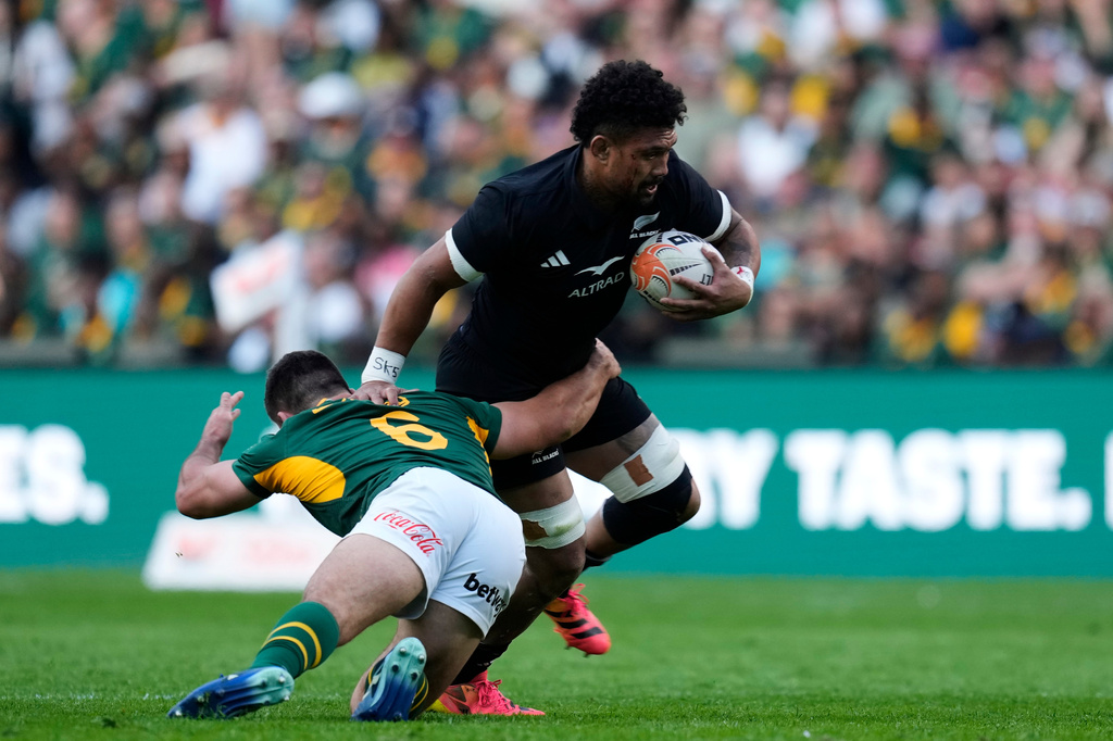 New Zealand's captain Ardie Savea, right, is challenged by South Africa's Paul de Villiers during a Test rugby match between South Africa and New Zealand, in Johannesburg, South Africa, Saturday, Aug. 22, 2026. (AP Photo/Themba Hadebe)