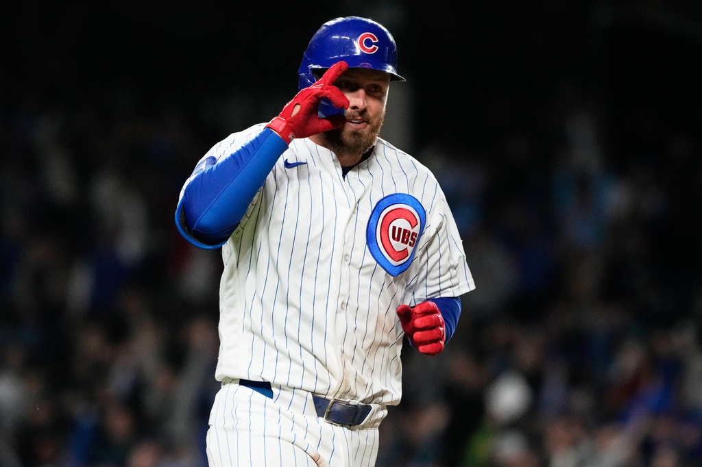 Chicago Cubs' Michael Busch celebrates as he rounds the bases after hitting a solo home run during the eighth inning of a baseball game against the Cincinnati Reds in Chicago, Tuesday, May 5, 2026. (AP Photo/Nam Y. Huh)