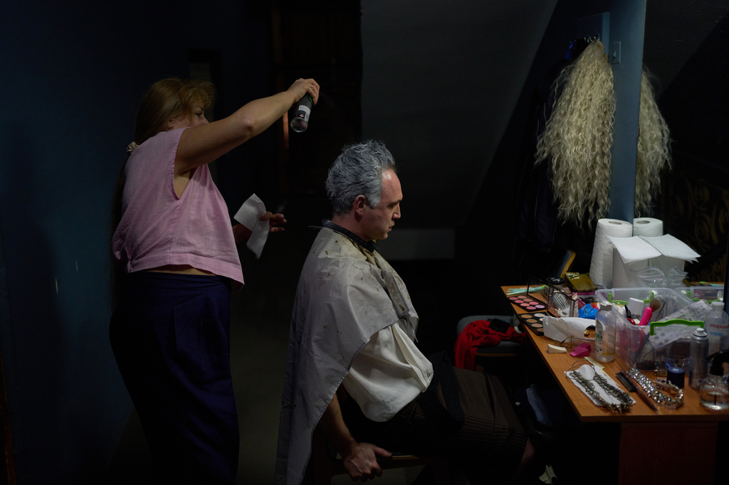 An actor gets his hair styled backstage before the final rehearsal of "Odyssey. Maeotis," which reimagines Homer’s epic, at Ivan Franko theater in Kyiv, Tuesday, Aug. 25, 2026. (AP Photo/Francisco Seco)