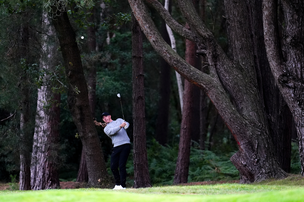 Rory McIlroy of Northern Ireland plays on day one of the BMW Championship golf tournament at Wentworth Golf Club, in Virginia Water, Surrey, England, Thursday Sept. 17, 2026. (Adam Davy/PA via AP)