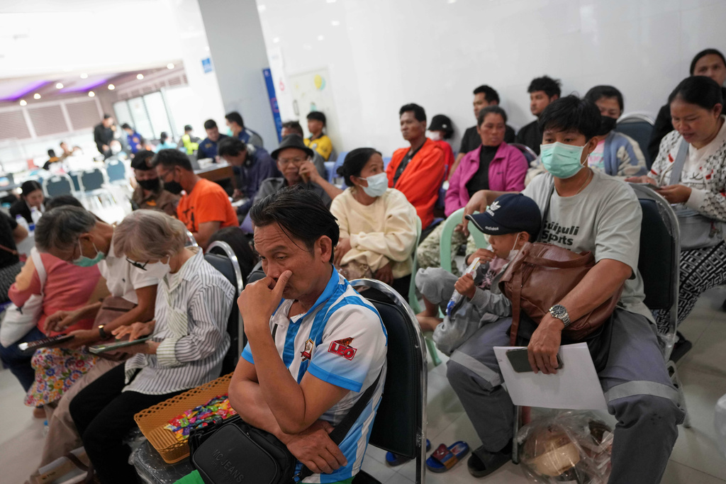 Relatives of victims and others wait at a hospital, a day after a construction crane fell into a passenger train in Nakhon Ratchasima province, Thailand, Thursday, Jan. 15, 2026. (AP Photo/Sakchai Lalit)