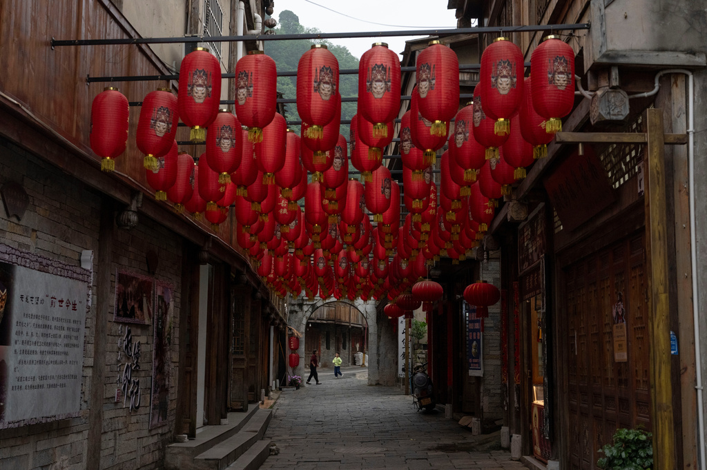 Red lanterns line a street of Tianlong Tunpu, an ancient town in southwestern China's Guizhou province on Thursday, May 28, 2026. (AP Photo/Ng Han Guan)