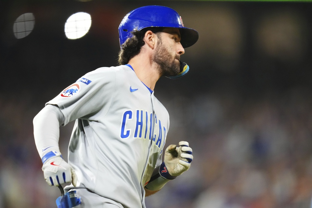 Chicago Cubs' Dansby Swanson rounds the bases after hitting a solo home run against the Colorado Rockies during the seventh inning of a baseball game Friday, Aug. 29, 2025, in Denver. (AP Photo/Jack Dempsey)