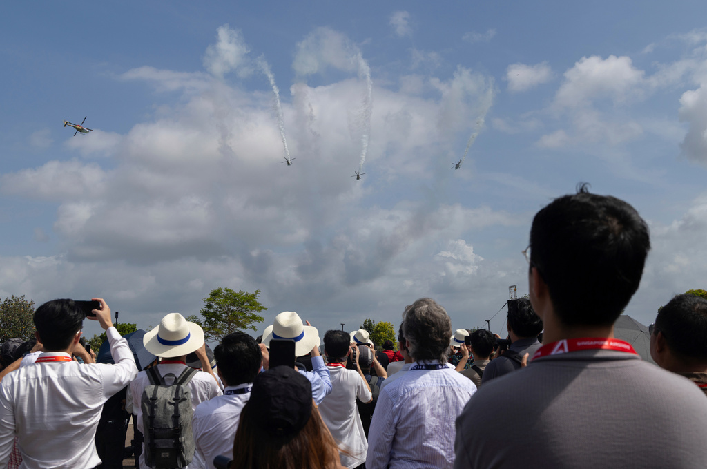 Spectators watch an air display during the Singapore Air Show on Thursdsay, Feb. 5, 2026. (AP Photo/Anton L. Delgado)
