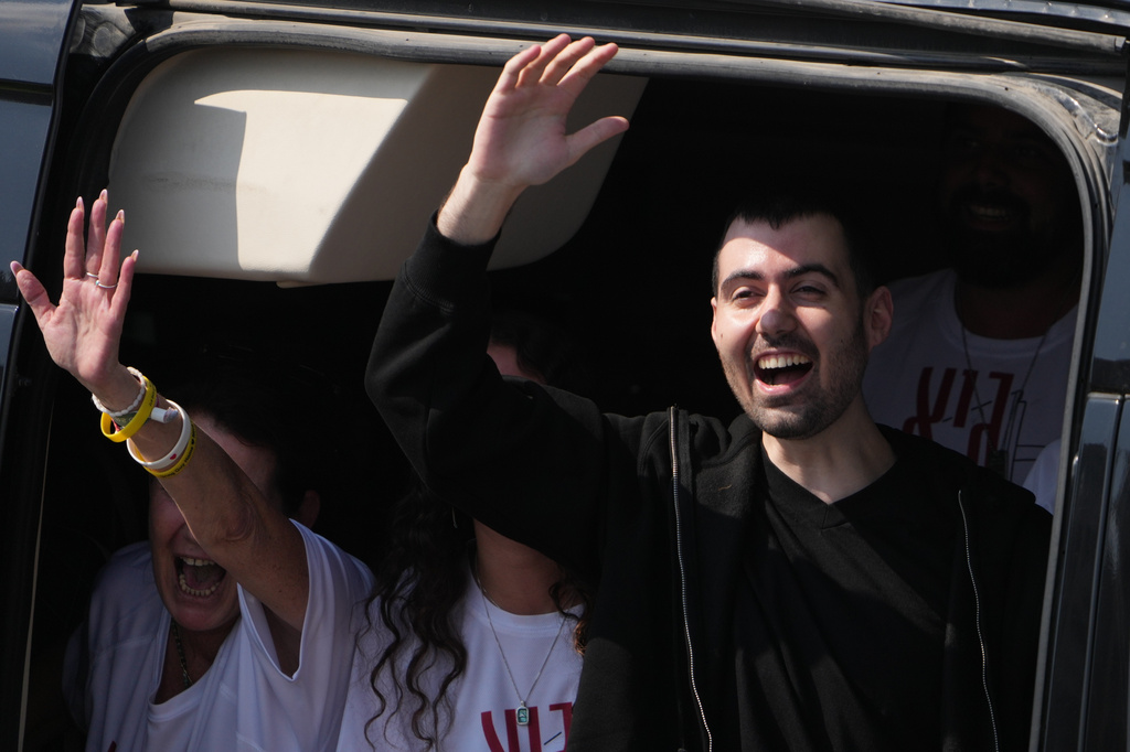 FILE - Freed Israeli hostage Guy Gilboa-Dalal gestures from a van as he arrives at Beilinson hospital in Petah Tikva, Israel, after he was released from Hamas captivity in the Gaza Stripl, Monday, Oct. 13, 2025. (AP Photo/Ariel Schalit, File)