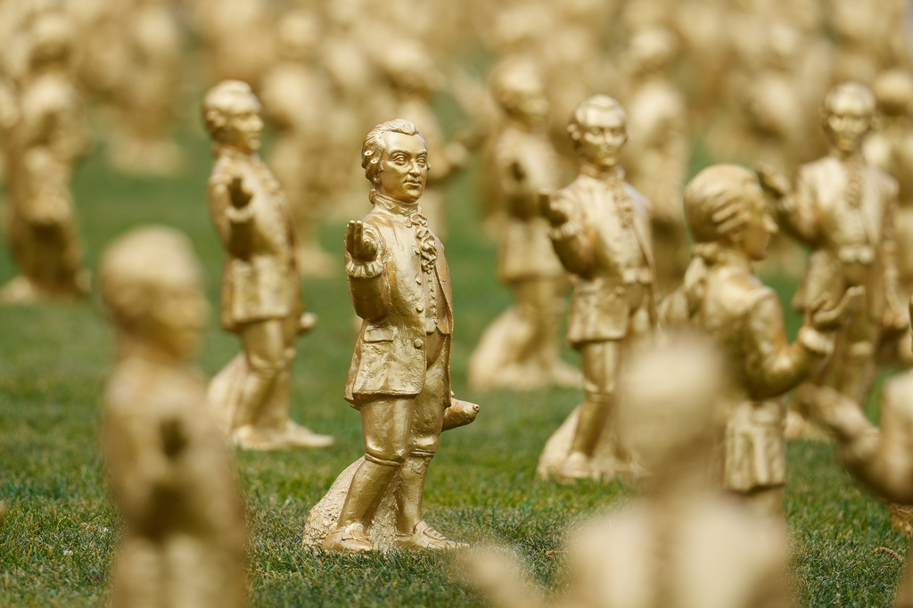 FILE - A view of some of the 400 gold colored plastic Mozart sculptures by German artist Ottmar Hoerl from Nuremberg for the 270th birthday of composer Wolfgang Amadeus Mozart in Salzburg, Austria, Wednesday, July 15, 2026. (AP Photo/Matthias Schrader, File)