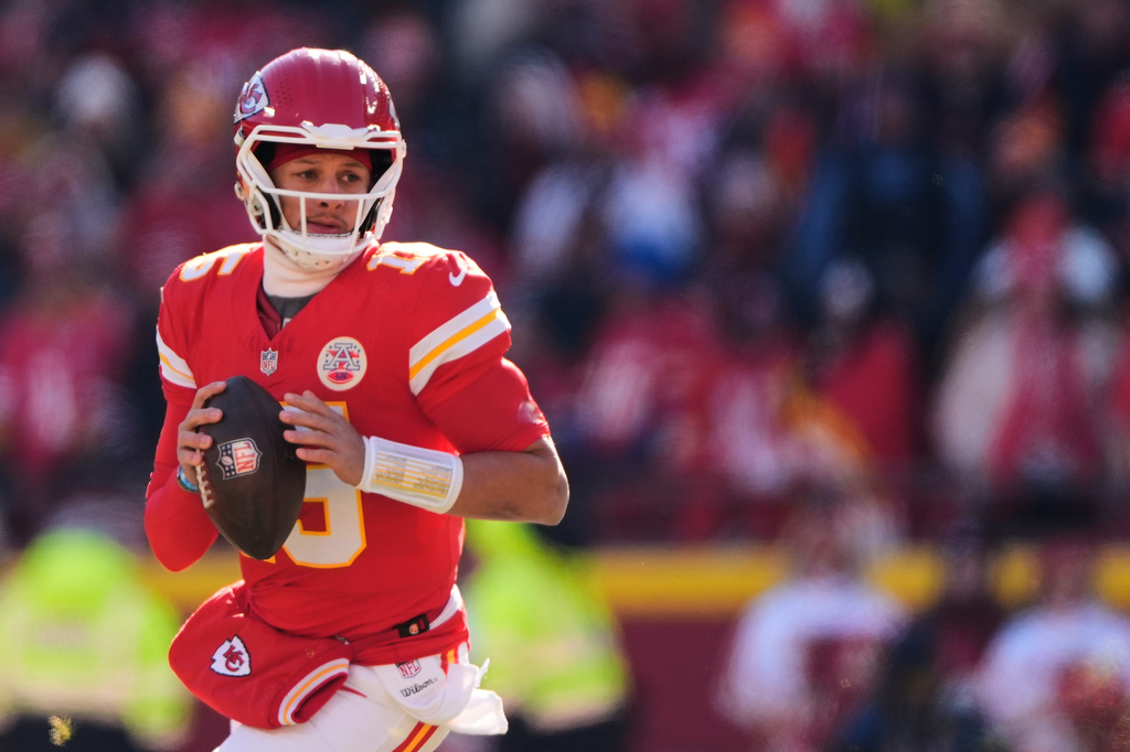 FILE - Kansas City Chiefs quarterback Patrick Mahomes looks to pass during the first half of an NFL football game against the Los Angeles Chargers, Dec. 14, 2025, in Kansas City, Mo. (AP Photo/Charlie Riedel, File)