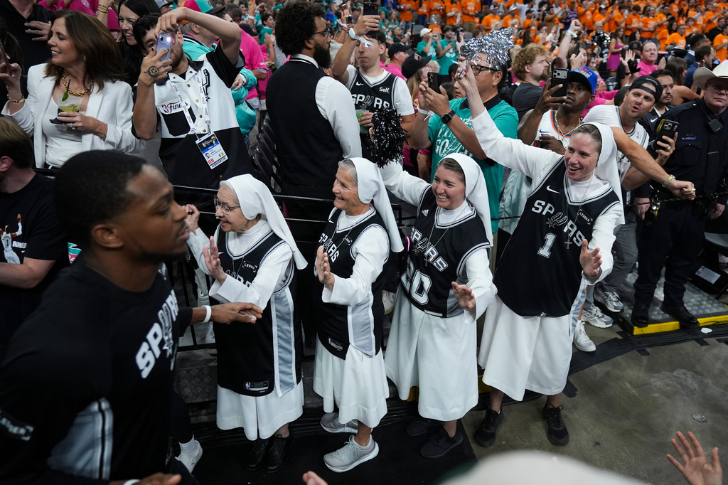 The Salesian Sisters greet players prior to Game 1 of the NBA Finals basketball series between the New York Knicks and the San Antonio Spurs, Wednesday, June 3, 2026, in San Antonio. (AP Photo/Eric Gay)