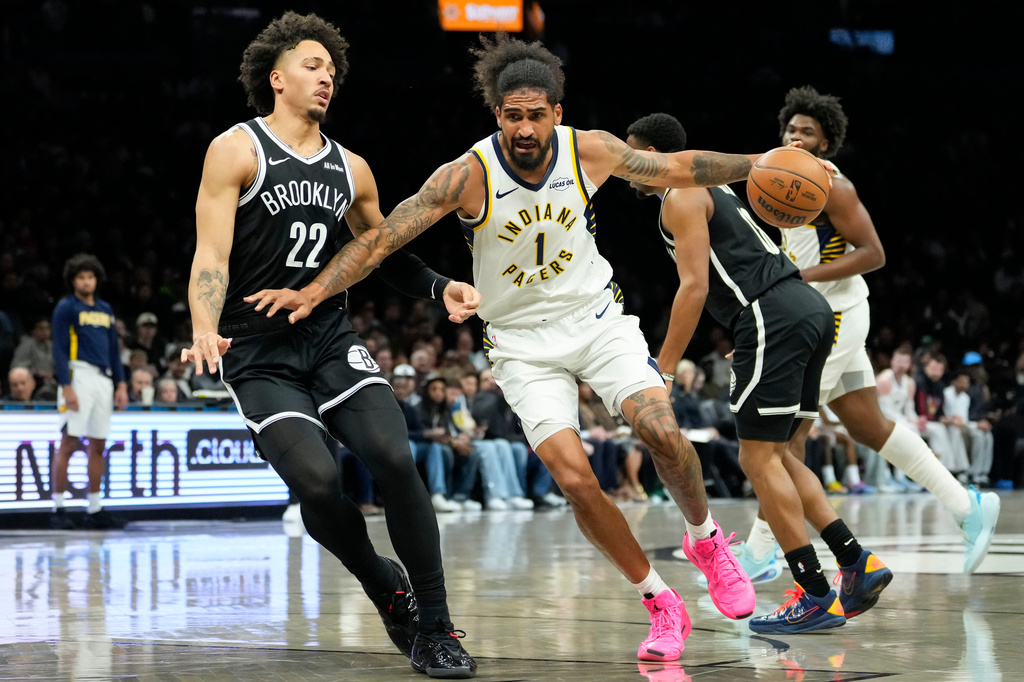 Indiana Pacers forward Obi Toppin (1) drives past Brooklyn Nets forward Jalen Wilson (22) during the first half of an NBA basketball game, Thursday, April 9, 2026, in New York. (AP Photo/Yuki Iwamura)