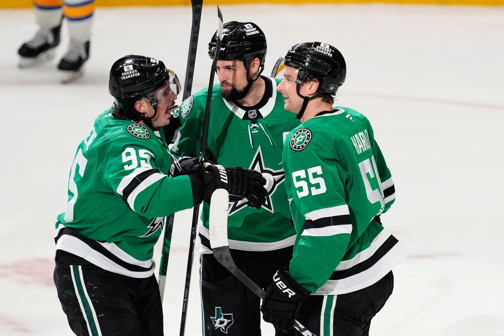 Dallas Stars' Matt Duchene (95), Jamie Benn (14) and Thomas Harley (55) celebrate Benn's goal in the second period of an NHL hockey game against the St. Louis Blues Wednesday, Feb. 4, 2026, in Dallas. (AP Photo/Tony Gutierrez)