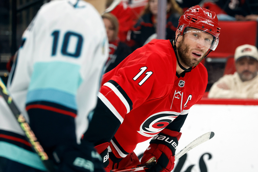 Carolina Hurricanes' Jordan Staal (11) readies for a face-off against the Seattle Kraken during the second period of an NHL hockey game in Raleigh, N.C., Saturday, Jan. 10, 2026. (AP Photo/Karl DeBlaker)