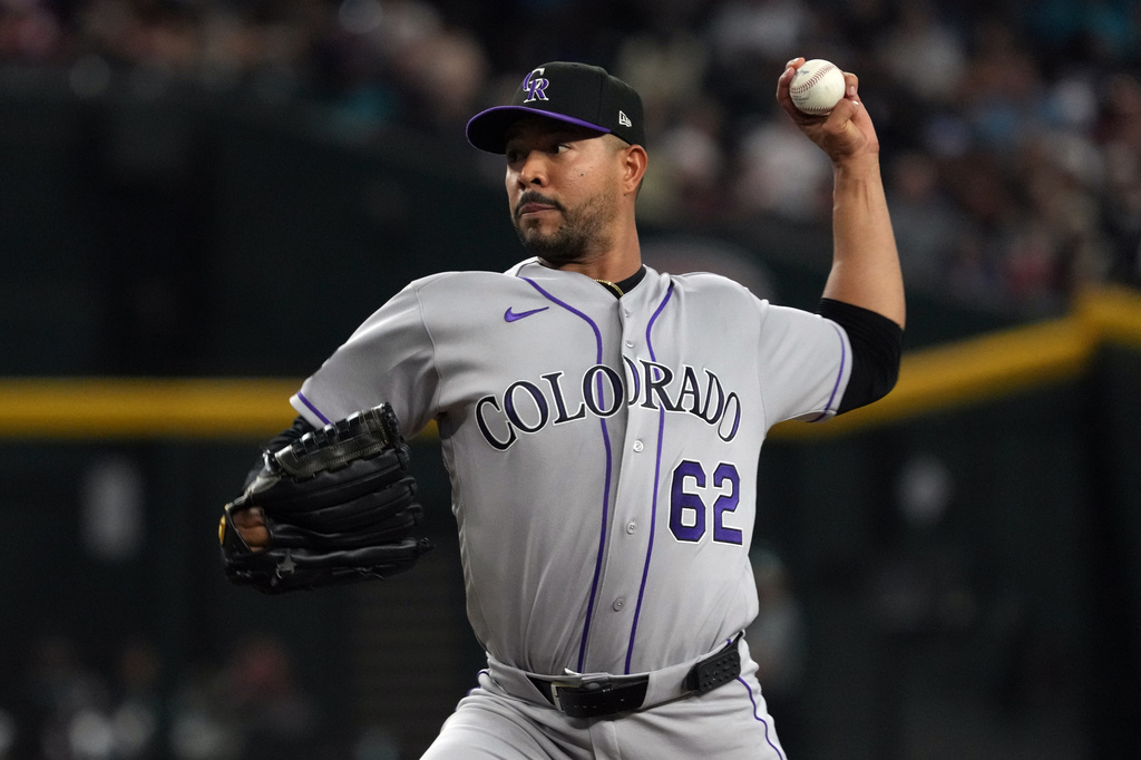 Colorado Rockies pitcher Jose Quintana throws against the Arizona Diamondbacks in the first inning of a baseball game, Sunday, May 24, 2026, in Phoenix. (AP Photo/Rick Scuteri)