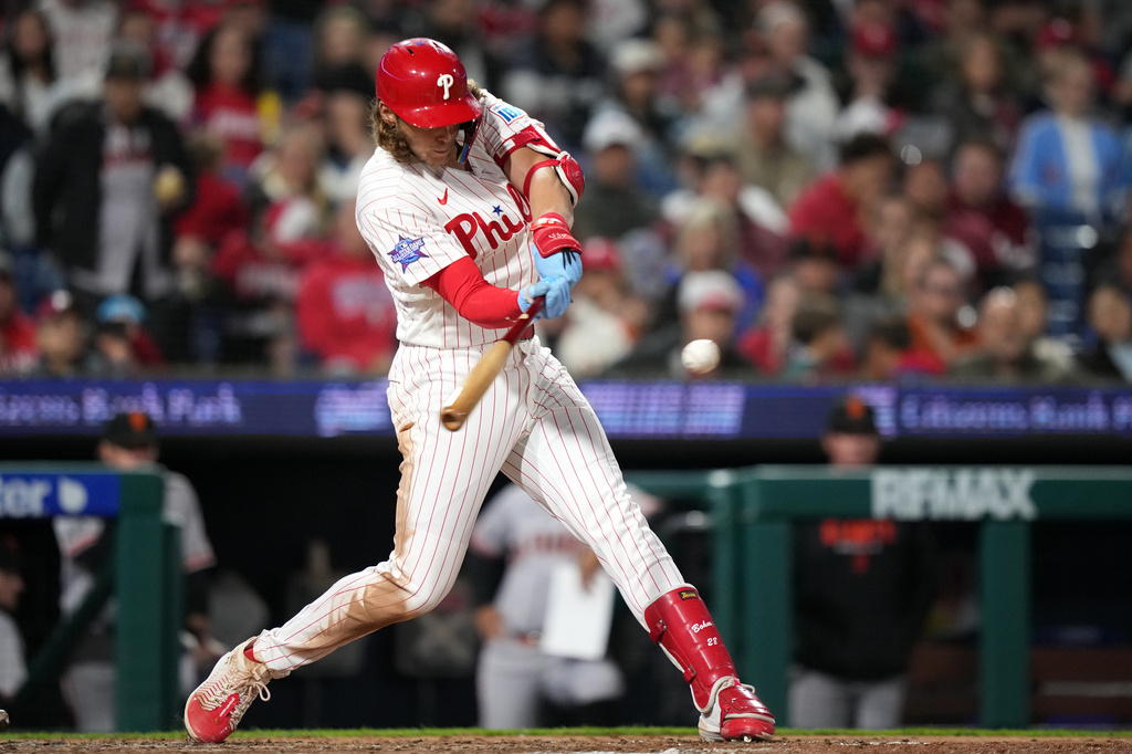Philadelphia Phillies' Alec Bohm hits a run-scoring double against San Francisco Giants pitcher Matt Gage during the sixth inning of a baseball game Tuesday, April 28, 2026, in Philadelphia. (AP Photo/Matt Slocum)