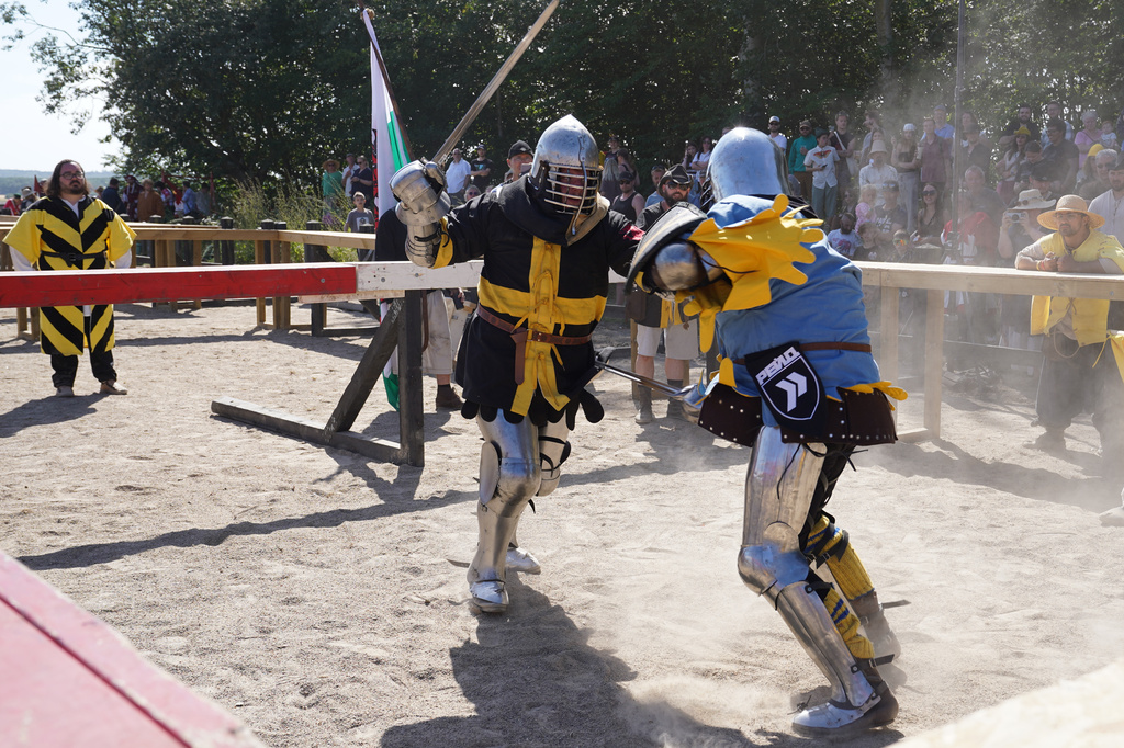 Two fighters battle during the International Medieval Combat Federation's World Championship at Spottrup Castle, in Spottrup, Denmark, Thursday, July 23, 2026. (AP Photo/James Brooks)