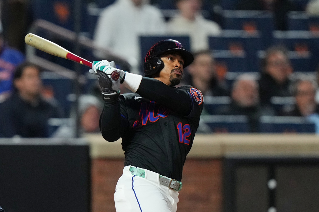 New York Mets' Francisco Lindor follows through on a three-run home run during the third inning of a baseball game against the Minnesota Twins Tuesday, April 21, 2026, in New York. (AP Photo/Frank Franklin II)