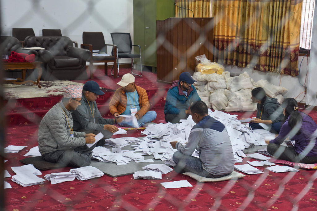 Election official count votes at a counting center for parliamentary election in Lalitpur, Nepal, Sunday, March 8, 2026. (AP Photo/Niranjan Shrestha)