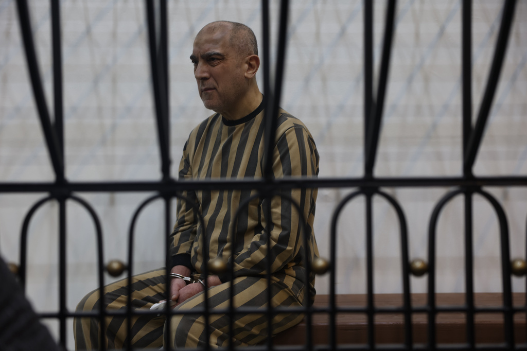Atef Najib, former head of the Political Security Branch in the Daraa area during Bashar Assad's rule, sits in the defendants' cage during a trial session at the Palace of Justice in Damascus, Syria, Sunday, April 26, 2026. (AP Photo/Ghaith Alsayed)