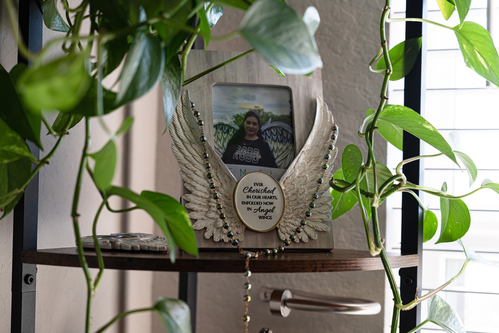 A framed photo of Robb Elementary teacher Irma Garcia is seen at the home of her sister, Velma Lisa Duran on Dec. 19, 2025, in San Antonio. (AP Photo/Kin Man Hui)