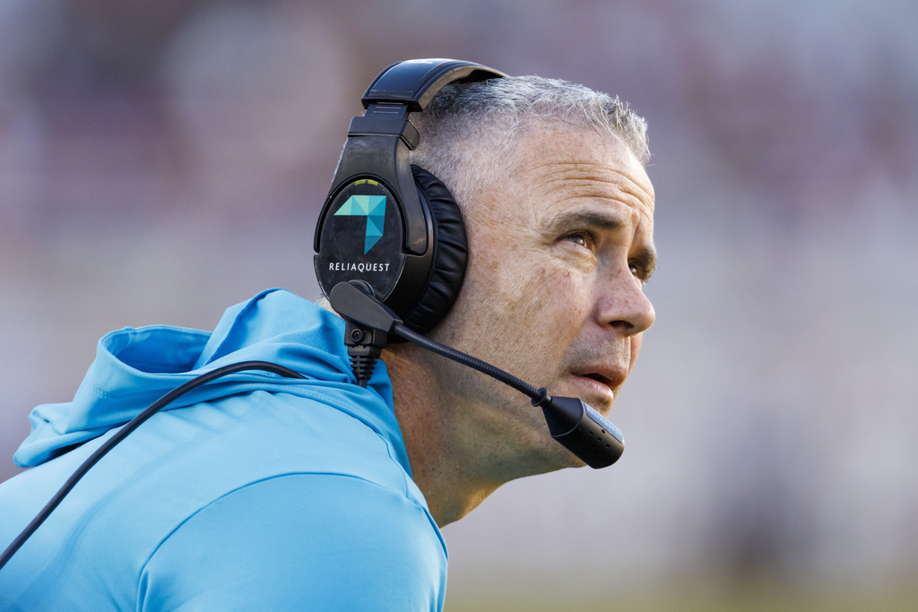 FILE - Florida State head coach Mike Norvell monitors the second half of an NCAA college football game against Charleston Southern, Saturday, Nov. 23, 2024, in Tallahassee, Fla. (AP Photo/Colin Hackley, File)