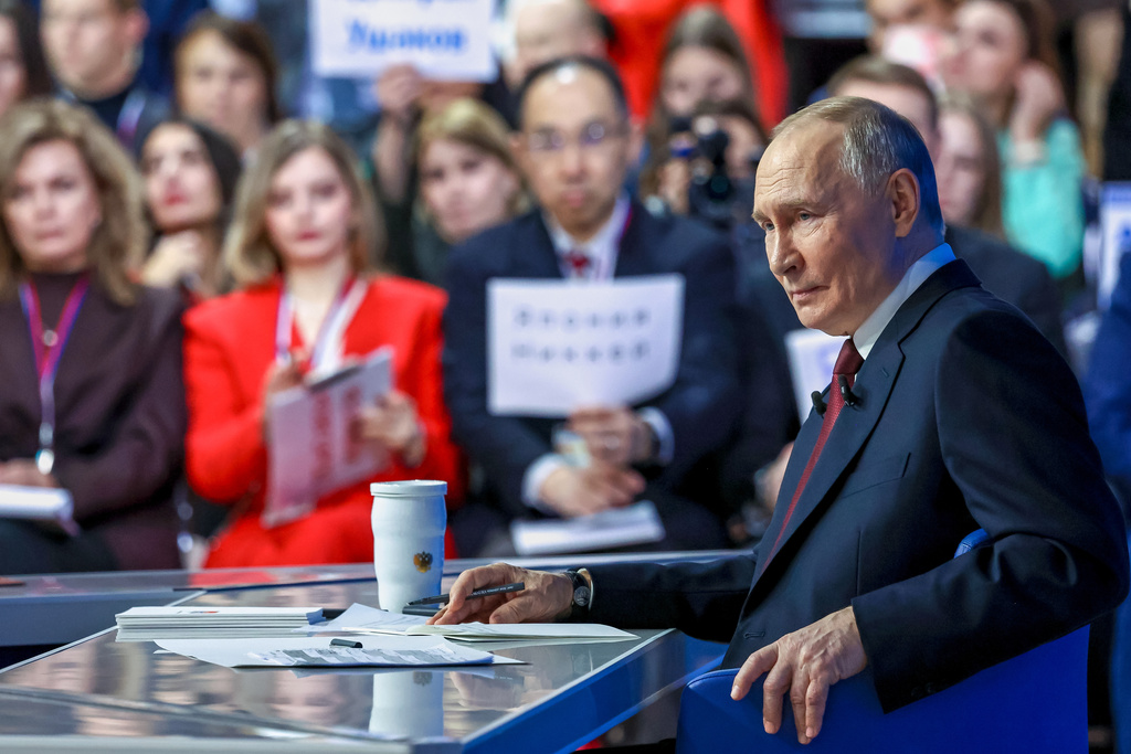 Russian President Vladimir Putin listens to a journalist's question during his annual news conference and call-in show at Gostinny Dvor, in Moscow, on Friday, Dec. 19, 2025. (Alexander Kazakov, Sputnik, Kremlin Pool Photo via AP)