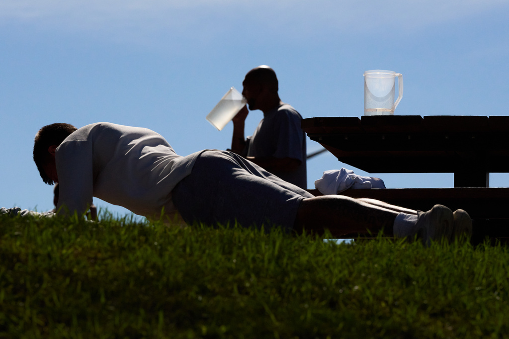 People who are incarcerated exercise and drink water at the Minnesota Correctional Facility in Lino Lakes, Minn., Tuesday, Sept. 15, 2026. (AP Photo/Ellen Schmidt)