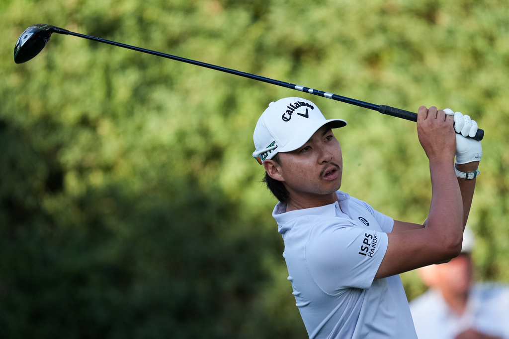 Min Woo Lee, of Australia, tees off the 10th hole during the first round of the Australian Open golf tournament in Melbourne, Australia, Thursday, Dec. 4, 2025. (AP Photo/Asanka Brendon Ratnayake)
