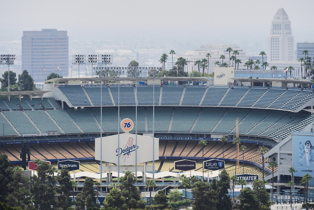 FILE - Dodger Stadium is shown before an evening baseball game, June 20, 2025, in Los Angeles. (AP Photo/Damian Dovarganes, File)