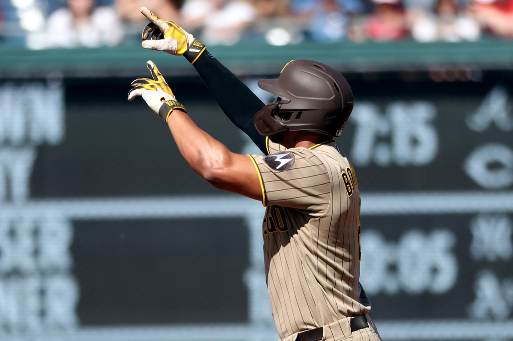 San Diego Padres' Xander Bogaerts celebrates after hitting a home run during the second inning of a baseball game against the Washington Nationals, Saturday, May 30, 2026, in Washington. (AP Photo/Daniel Kucin Jr.)