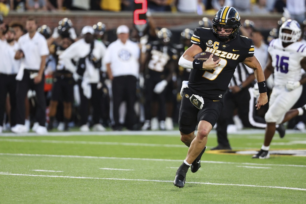Missouri quarterback Beau Pribula (9) runs with the ball for a touchdown during the first half of an NCAA college football game against Central Arkansas Columbia, Mo., on Thursday, Aug. 28, 2025. (Liz Rymarev/St. Louis Post-Dispatch via AP)