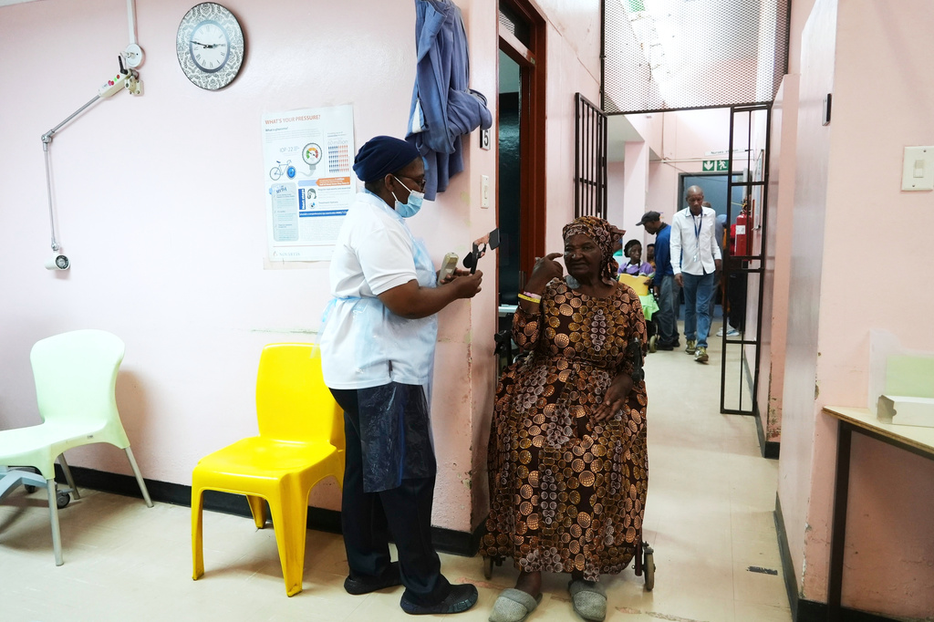 Gladys Khoza undergoes a post-operative eye test after cataract surgery, in Tsakane, South Africa, Saturday, March 28, 2026. (AP Photo/Kayleen Morgan)